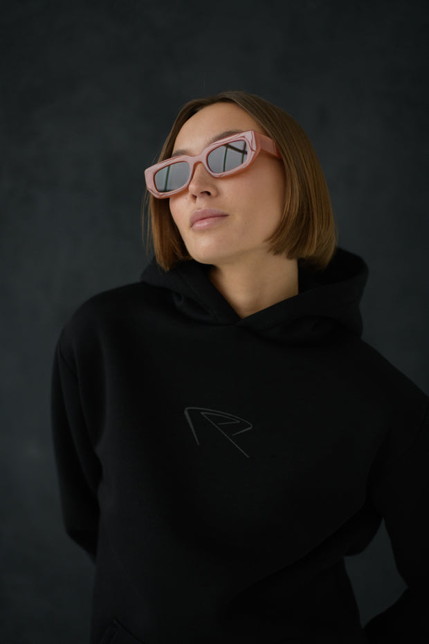 Female model wearing All Black Everything Hoodie